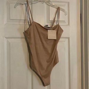 Kittenish nude body suit